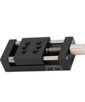 Knockout Heavy Duty Manual Linear Actuator Stage Featuring Smooth Glide Aluminum Dovetail Slide Platform And Dead Set Micro Tuning Adjustments For Real World Job Sites detailed view of black linear actuator with adjustment knobs.