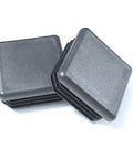 Rock Solid Pack Of Four 1.5 Inch Square Black Plastic Tubing Plugs With Grippy Ribbed Inserts stacked on a white background.