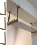 Heavy Duty Black Pipe Ceiling Shelf Bracket Mount With Screws For Kitchen Living Room Or Garage Durable Metal Hanging Shelf System Built To Last And Keep Your Pad Organized installed in a room with white shelf.