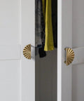 Champagne Bronze Cabinet Pulls 2.5 Inch Hole Centers Fan Shaped Zinc Alloy Drawer Pulls 6 Pack for Kitchen Cabinets and Furniture Modern Upgrade Rust Resistant Accessible Luxury Hardware installed on white wardrobe doors.