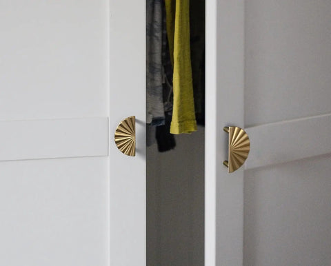 Champagne Bronze Cabinet Pulls 2.5 Inch Hole Centers Fan Shaped Zinc Alloy Drawer Pulls 6 Pack for Kitchen Cabinets and Furniture Modern Upgrade Rust Resistant Accessible Luxury Hardware installed on white wardrobe doors.