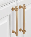 5 Inch Center-To-Center Champagne Bronze Cabinet Pulls installed on white cabinet doors, showing 6.2 Inch Length and zinc alloy material.