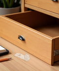 24 Pack Heavy Duty Plastic Shelf Pegs For Cabinets Self-Locking Curved Clips on wooden desk next to open drawer