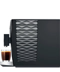 Top Shelf Automatic Coffee Machine In Sleek Piano Black Featuring Fresh Aroma Grinder PEP Brew Tech Dual Cup Options And Killer Crema side view with espresso cup.