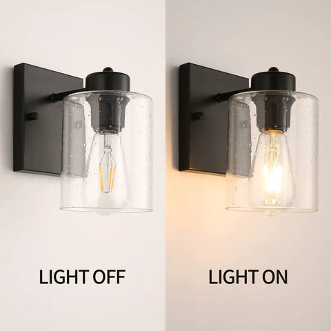 Set Of Two Matte Black Wall Sconces With Clear Glass Shade, Industrial Farmhouse Vanity Lighting Fixtures For Bathroom Mirror And Hallway, Bulbs Not Included, showing light off and light on.