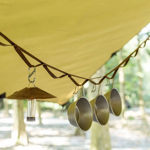 Heavy Duty Camping Lanyard Ten Feet With 19 Loops Daisy Chain Gear Hanger securing mugs and a lantern under a tent.