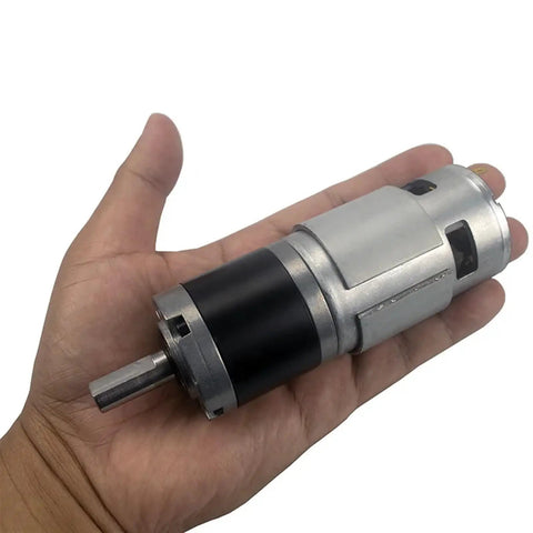 Hand holding 12V 24V DC Low Speed Long Life 42mm Planetary Gearbox Motor Brushed Gearmotor, showcasing compact and durable design.
