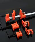 Heavy Duty Steel Pipe Clamp Set For Woodworking Hand Crank Adjustable Vise showing orange clamps and metal rod for secure grip.