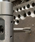 Close-up of M5 X 0.8 Helical STI Thread Repair Kit in use, showing tap tool and inserts for repairing damaged holes in metal