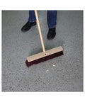 Straight Up Heavy Duty 18 Inch Floor Brush Head Featuring A Rock Solid Hardwood Block And Tough Maroon Polypropylene Bristles For Serious Industrial Sweeping Duties Handles Sold Separately on grey floor.