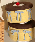 Legit Handwoven Cotton Storage Basket With Snug Dustproof Lid Solid Home Hub Organizer Perfect For Bedroom Clothes And Living Room Gear Nifty Space Saving Set Up You Will Score, stacked with blue bows.