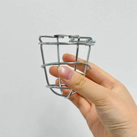 Pair Of Badass Fire Sprinkler Head Guards Made From Rust Resistant Stainless Steel Heavy Duty Cage Covers For One Half And Three Quarter Inch Systems being held in hand.
