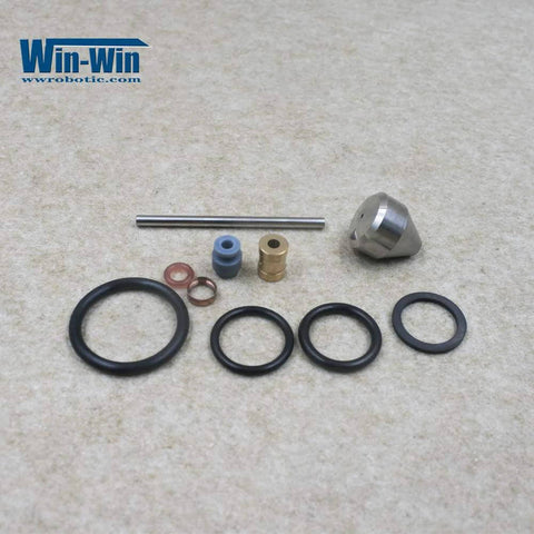 Top-view waterjet maintenance kit components: seals, O-rings, brass bushings, blue spacer, steel rod, conical nozzle; Win-Win logo.