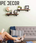 Hella Sturdy Industrial Pipe Shelf Brackets Six Inch Four Pack wall mounted shelves with rustic decor and black steel pipe fittings.