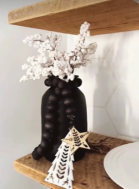 Straight Up Charred Aging Wood Stain For Interior Projects on black vase with white floral arrangement.