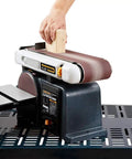 Rugged Belt And Disc Sander Combo For Woodworking With 4 By 36 Inch Belt And 6 Inch Disc Tilt Tables in use, shaping wood block