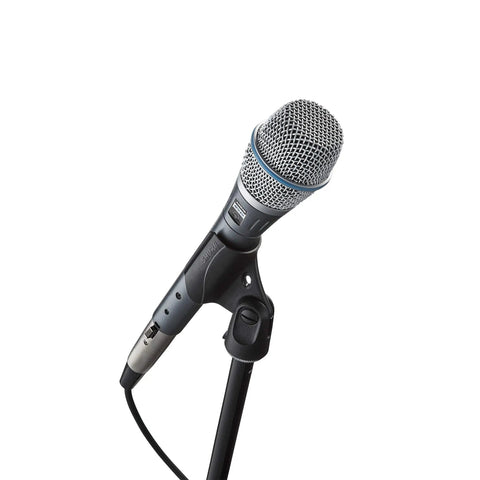BETA 87A Studio Grade Vocal Microphone With Built In Pop Filter on a stand, showcasing supercardioid condenser design for live gigs.