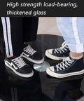 People standing on Heavy Duty Rotating Glass Lazy Susan Tray for Dining Tables and Kitchens, demonstrating strength
