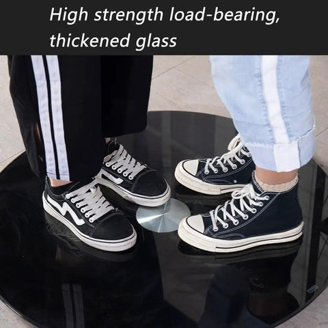 Two people standing on Beefy Black Glass Turntable Bearing With Silent Swivel Lazy Susan, showcasing high strength glass.