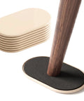 Eight Pack Heavy Duty Furniture Sliders For Carpet And Hardwood Flooring Featuring A Thick Cushioned Buffer for table legs.