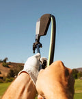 Right Hand Golf Swing Training Aid That Improves Clubface Awareness, Swing Plane, And Impact in action on a golf course