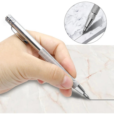 Top Tier Two Pack Tungsten Carbide Scribe Pens With A Freaking Strong Magnet And Steel Rule Including Ten Spare Tips For Quick Layouts And No Drama Metal Marking On Job Sites Everywhere, hand using pen on marble.