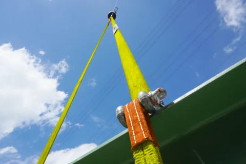 One Inch By Six Foot Flat Eye To Eye Lifting Sling Beefy Heavy Duty Polyester Strap For Construction And Hoisting 3200 Lbs WLL Vertical Lift 2500 Lbs WLL Chock Lift 2 Ply 1 Pack installed on construction beam against sky