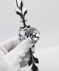 Close-up of a 12 Pack Diamond Clear Crystal Glass Cabinet Knob Set with Plate and Screws, silver detail held in a gloved hand.
