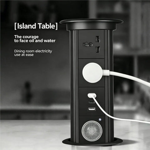 Auto Rises Pop Up Outlet Slick Aluminum Desk Power Strip With Swappable Modules Quick Charge Ports And Optional Speaker on kitchen island.