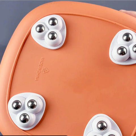 Close-up of 8 Pack Mini Swivel Caster Wheels With Self Adhesive Backing And Triple Ball Bearings on an orange surface.
