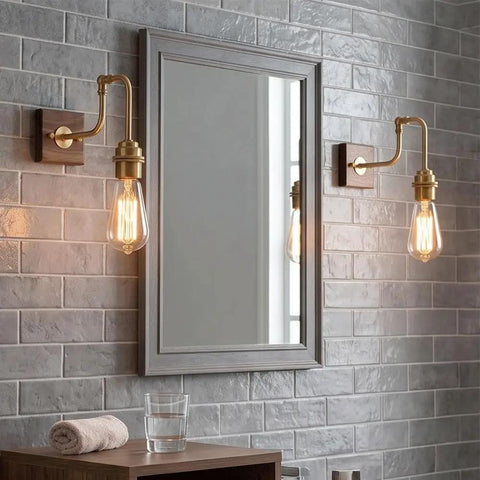 Vintage Brass Wall Sconce, Industrial Wood Light Fixture with adjustable arm beside mirror in modern bathroom setting.