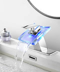 Waterfall Glass Spout LED Temperature Changing Bathroom Faucet With Single Handle Deck Mounted Cold Warm Hot Water Mixer Chrome Finish Four Color Modes And Temperature Warning Light showing blue LED light in use