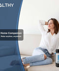 Woman relaxing on couch with Hydrogen Water Generator Bottle With Dual Chamber SPE PEM Tech beside her.