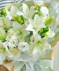 White flowers wrapped in 20 Sheets Flower Wrapping Paper Pack With 22 Inch Double Color Floral Bouquet Paper for gifts and DIY.