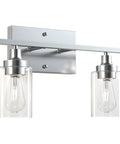 Two-Light Vanity Light With Clear Ribbed Glass Shades And Nickel Finish For Bathroom Over Mirror Modern Industrial Chic Style E26 Standard Socket Durable Build Easy Install Ideal For Master Or Guest Bathrooms. Brushed nickel base with clear glass.