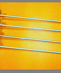 Half Inch By Thirty Inch Screw Anchor Set With Four Inch Helix Pack Of Four Galvanized Anchors for storage buildings laid on orange background
