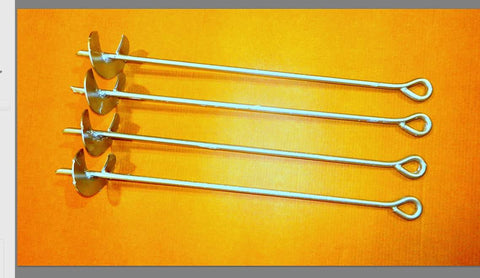 Half Inch By Thirty Inch Screw Anchor Set With Four Inch Helix Pack Of Four Galvanized Anchors for storage buildings laid on orange background