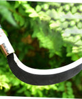 Close-up of manganese steel sickle blade and ergonomic handle, part of the Manganese Steel Sickle Set With Ergonomic Handle, Two Pack For Gardening.