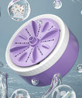 Portable Mini Washing Machine With USB Rechargeable Cordless Setup For Dorm And Travel Featuring Dual Turbine Agitator and suction base in water.