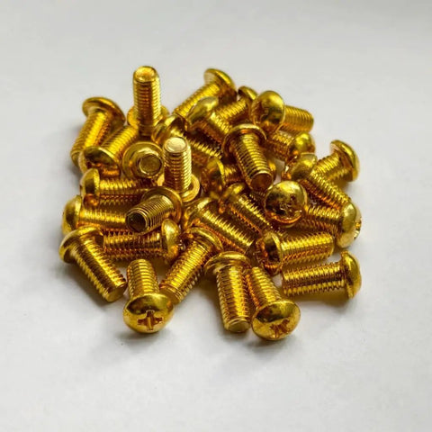 Premium M5 X 10mm Brass Phillips Pan Head Machine Screws scattered on a white surface, fully threaded and corrosion resistant.