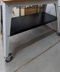 Heavy Duty Swivel Stem Castors with Red PU Wheels installed on a metal cart in a garage setting, non-marking, double locking