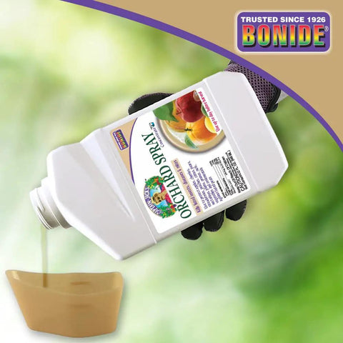 Hand pouring Citrus Fruit Nut Orchard Spray 32 Oz Concentrate Multi Purpose Fungicide Insecticide And Miticide into container