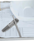 Double Head Screw Extractor Set for Stripped Screws and Broken Water Pipes shown on construction plans with a hard hat