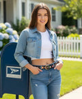 Women's Floral Embroidered Black Leather Belt With Antique Brass Buckle And Vintage Boho Country Style Soft Pu Leather Waistband worn with a denim jacket and jeans.