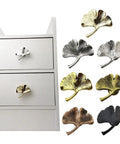 Ginkgo Leaf Zinc Alloy Cabinet Handle For Doors And Drawers, sturdy pull set in ancient gold and red bronze, shown on drawer