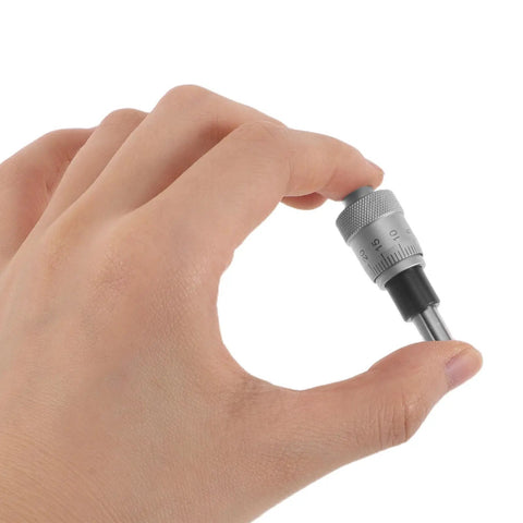 Hand holding Stainless Steel Micrometer Head 0-6.5mm With Modular Interfaces And Precise Microadjustment For Industrial Metrology Workflows Pro Grade CNC Fixtures Sliding Gauges And Machining Measurement Tools