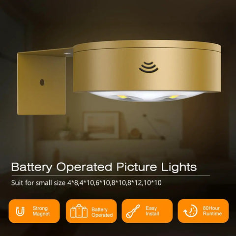 Wireless battery operated picture light in gold finish showing remote sensor, ideal for art frames with smooth dimming.