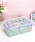 Clear 3 Layer Plastic Dividing Storage Box With Adjustable Spacers Portable Handle Craft Organizer in haze green on table