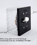 Back view of Ice Cube Solar Glass Brick Path Lights 4 Pack For Garden And Yard with on/off switch and battery compartment.