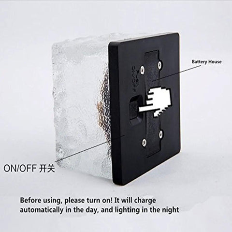 Back view of Ice Cube Solar Glass Brick Path Lights 4 Pack For Garden And Yard with on/off switch and battery compartment.
